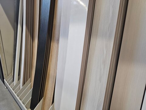 Different types of wooden panels on display in a store for customers