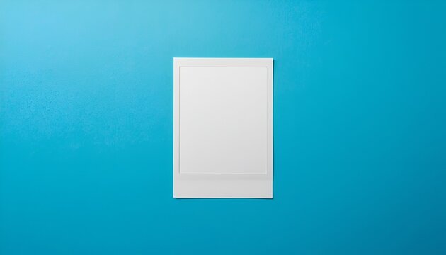 Blank Vintage Polaroid Photo with White Border on Vibrant Blue Background, Minimalist Retro Photography Mockup with Glossy Finish