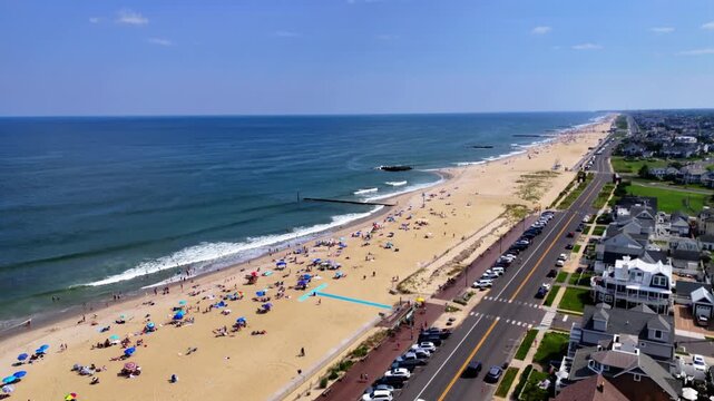Aerial shot of Belmar Beach, New Jersey, with many people enjoying a sunny day