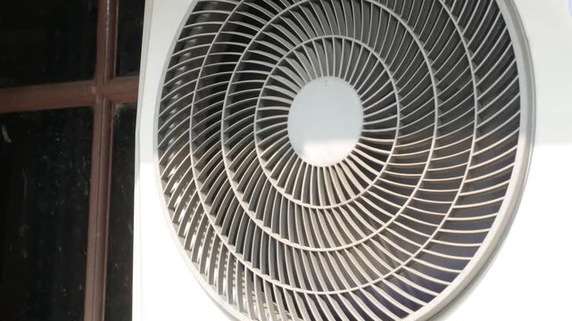 Outdoor Air Conditioner Condenser Unit Running in Daylight