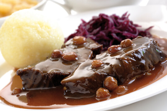 Roast beef with side dishes, tilt view, typical of Rheinland, Germany