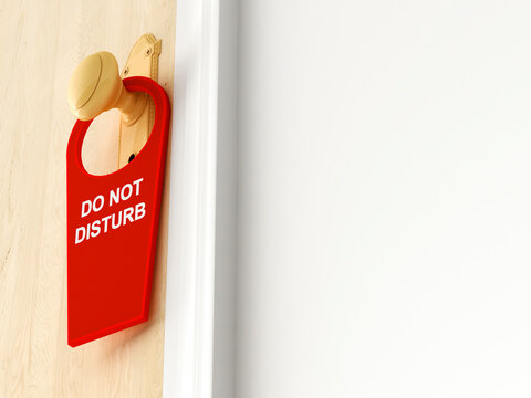 Tag with 'Do not disturb' hanging on doorknob