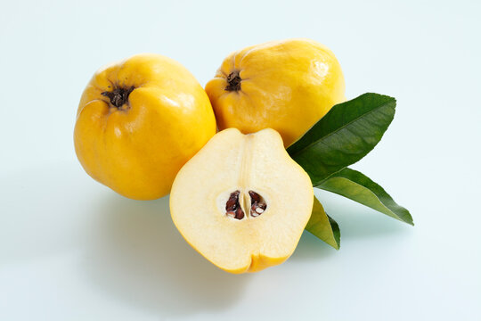 Quinces on white background, close up