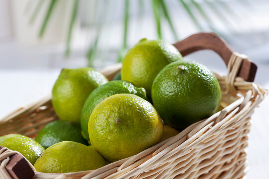 Limes in basket, studio shot