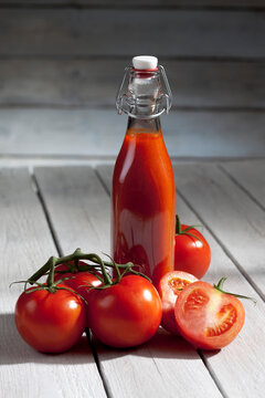 Homemade tomato juice on wooden table