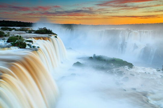 South America, Argentina, Brazil, Iguazu National Park, Iguazu Falls at sunset