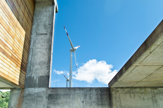 Modern concrete architecture frames a wind turbine in Loja Ecuador