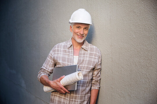 Portrait of a mature man, wearing hard hat