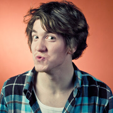 Man making funny faces and pouting, portrait