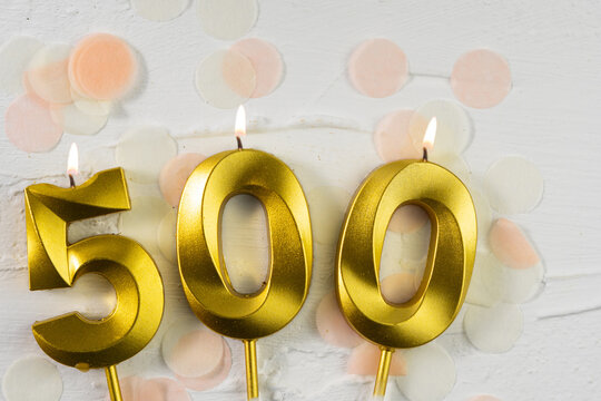 500 followers or subscribers. card golden birthday candle five hundred on confetti background. Template for social networks, community fans.