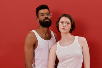 Fototapeta premium Loving multiracial couple sharing a beautiful moment in stylish chic attire