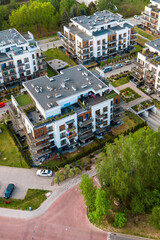 Fototapeta premium Top-down view of modern apartment buildings with green roofs