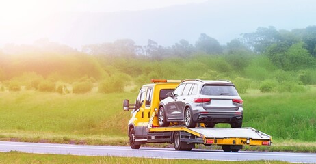 Yellow carrier truck offers roadside service © AlexGo