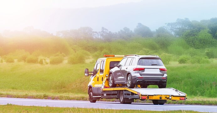 Yellow carrier truck offers roadside service