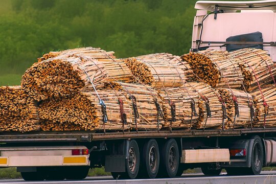 Road transport truck delivering lumber to construction sites