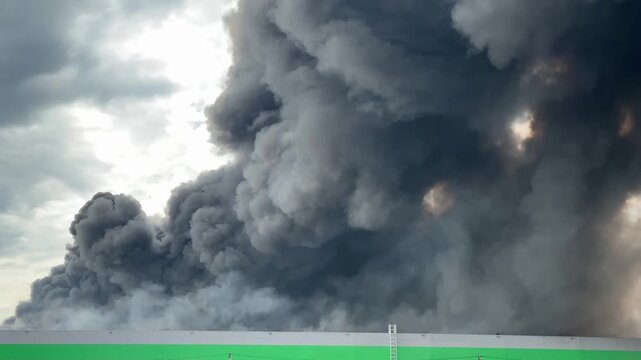 Firefighters Extinguishing Massive Warehouse Fire