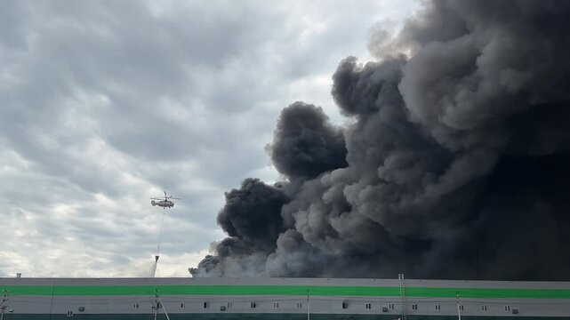 Firefighters Extinguishing Massive Warehouse Fire