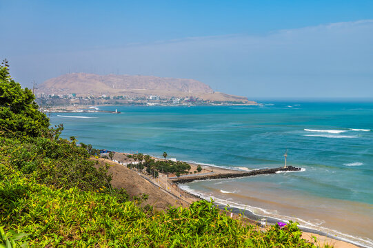 A view down the coastal cliffs  towards the Morro Solar headland in Lima, Peru in the dry season