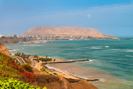 A view down the coast towards the Morro Solar headland in Lima, Peru in the dry season