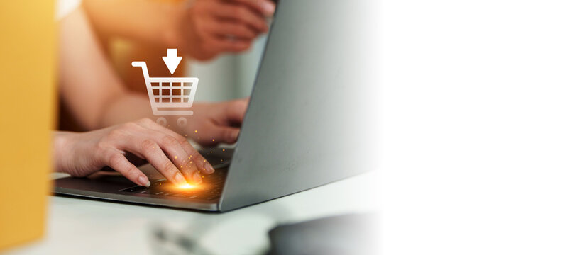 Cropped hands typing on laptop for online shopping e-commerce technology concept