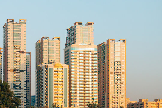 New Residential Multi-storey Houses. Cityscape Skyline In Sunny Spring Evening On Blue Sky. Real Estate, Development Industry. UAE