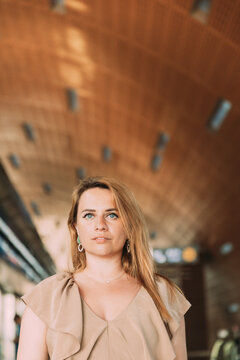 Portrait of young caucasian woman lady tourist traveler standing on the Dubai metro train station. High quality photo