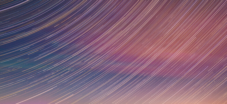 Panoramic View Of Night Sky. Unusual Stars Effect Sky. Meteors Fly Across Night Sky. Large Exposure. Blurred Stars In Sky. Soft Colors. Light Magenta Sky Background. Amazing Stars Effects In Sky. Blue