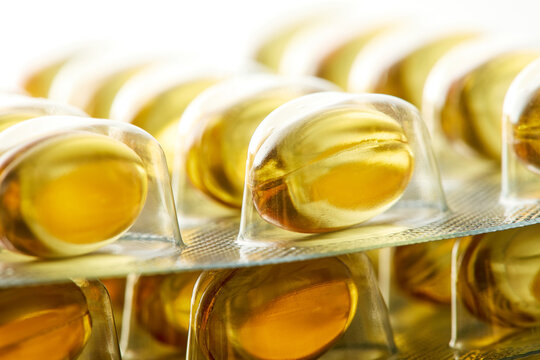 Yellow softgel vitamin capsules Omega 3 In blister packs