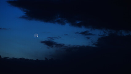 Blue hour time with crescent Moon, stars and planets. © astrosystem