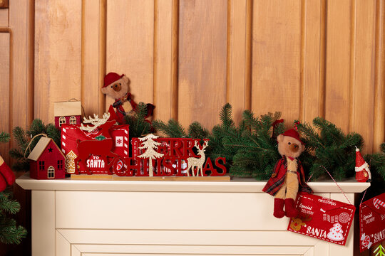 Festive Christmas mantelpiece decorations with bears and fir garland