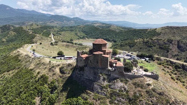 Aerial drone view of Jvari Monastery above Mtskheta, overlooking the confluence of Aragvi and Mtkvari rivers, Caucasus mountains and scenic landscape of Georgia