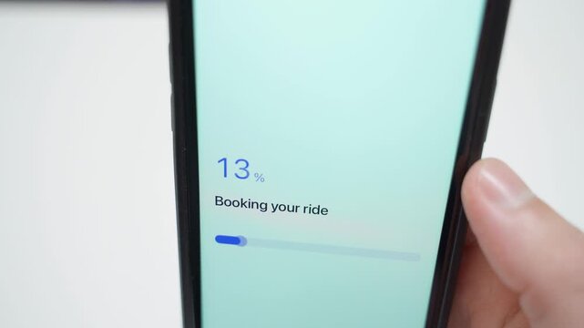 Smartphone screen showing ride booking progress and confirmation that driver is on the way