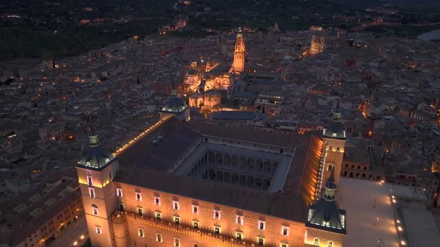 Aerial night view of the historic Toledo, Illuminated medieval city with Alcazar of Toledo Castilla-La Mancha, Spain.