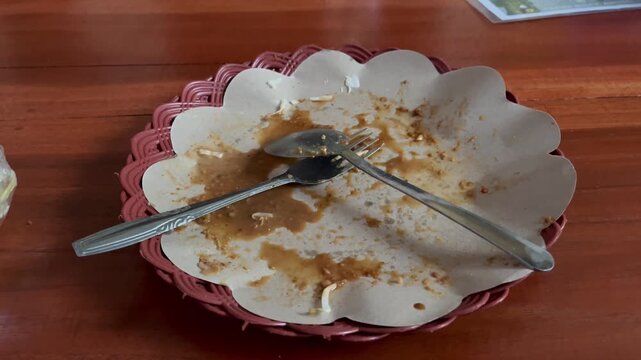 Close up look of empty white plate after eating traditional indonesian food