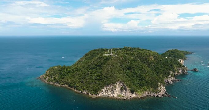Aerial drone of Apo island popular dive site and snorkeling destination with tourists. Negros, Philippines.