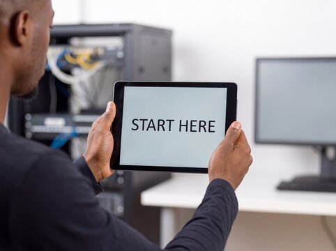 START HERE on tablet held by IT trainee in server room