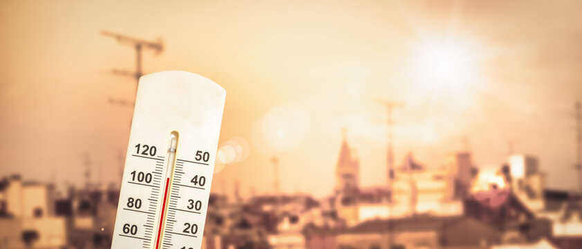 Extreme Heat Wave Over City Skyline with Thermometer and Blazing Sun
