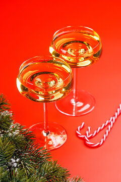 Champagne glasses and snowy fir branches