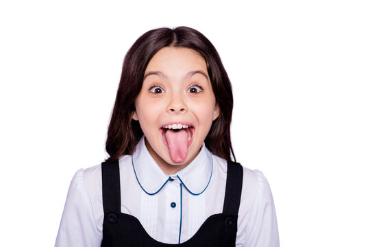 Close-up portrait of her she nice attractive cheerful cheery naughty wavy-haired pre-teen girl showing tongue out having fun isolated over bright vivid shine violet background