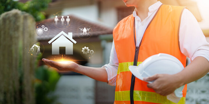 Engineer holding smart home interface for artificial intelligence technology in construction