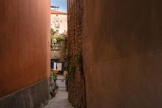 Scenic views of old town Labin in Istria, Croatia. Historic stone houses, tiled roofs, church facade, cozy narrow streets,