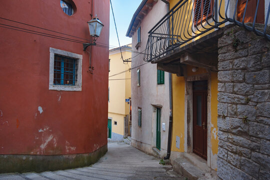 Scenic views of old town Labin in Istria, Croatia. Historic stone houses, tiled roofs, church facade, cozy narrow streets,