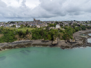 Aerial drone view of underwater oyster farms in Cancale, Brittany, covered during high tide, raditional sustainable aquaculture and production of premium French oysters, France © barmalini