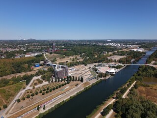 Fototapeta premium Aerial View of Nordsternpark Construction Site with Rhine-Herne Canal and Double Arch Bridge in Gelsenkirchen Germany