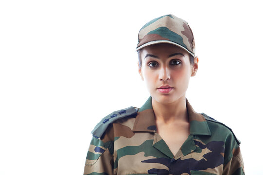 Close-up of woman army soldier against white background 