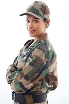 Profile view of female soldier against white background 