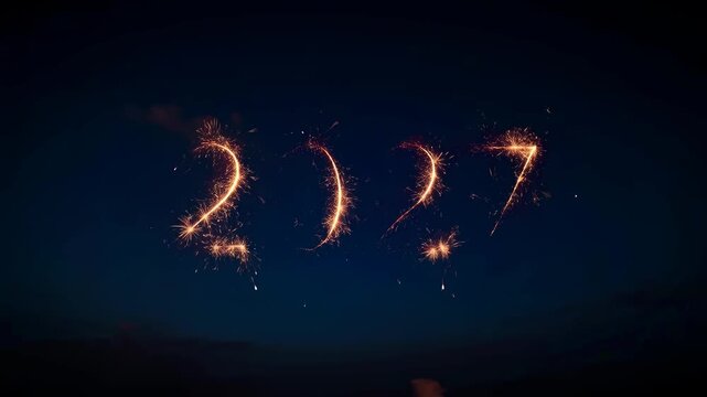 New Year 2027 Sparkler Light Celebration on Dark Night Sky with Firework Numbers