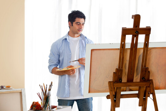 Male artist at work in studio 