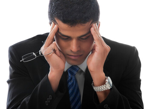 Business man suffering from severe headache 