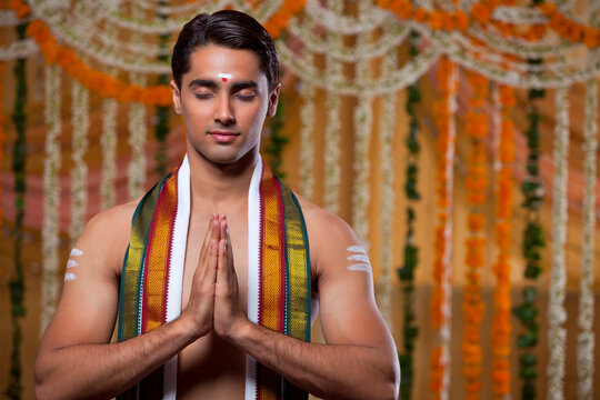Handsome groom praying 